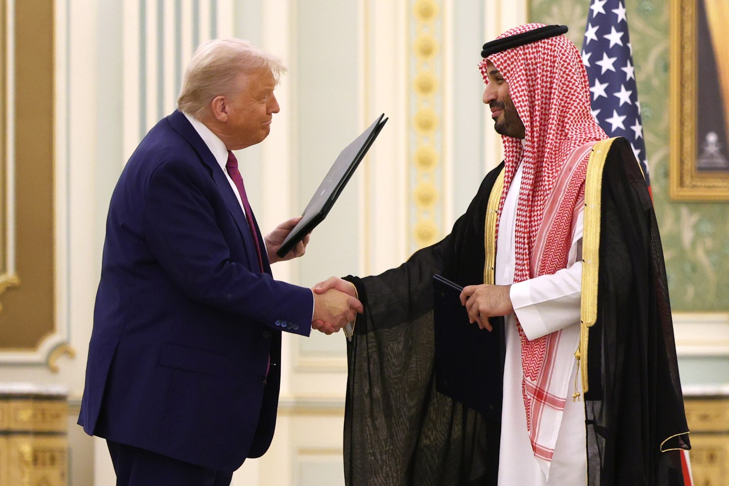 U.S. President Donald Trump shakes hands with Saudi Crown Prince Mohammed Bin Salman during Trump&#039;s visit to the Middle East.